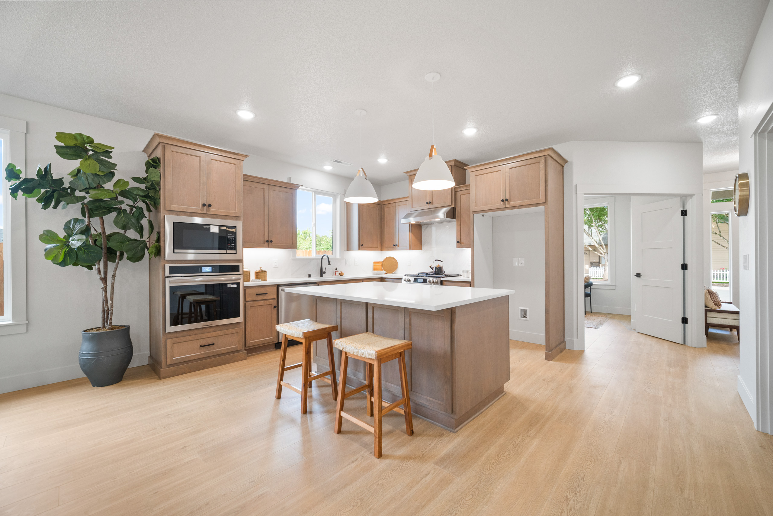 Modern kitchen with white cabinets and a large island.