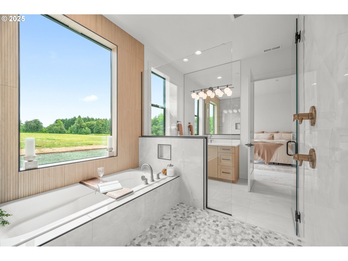 Bright modern bathroom with a large window and a soaking tub.