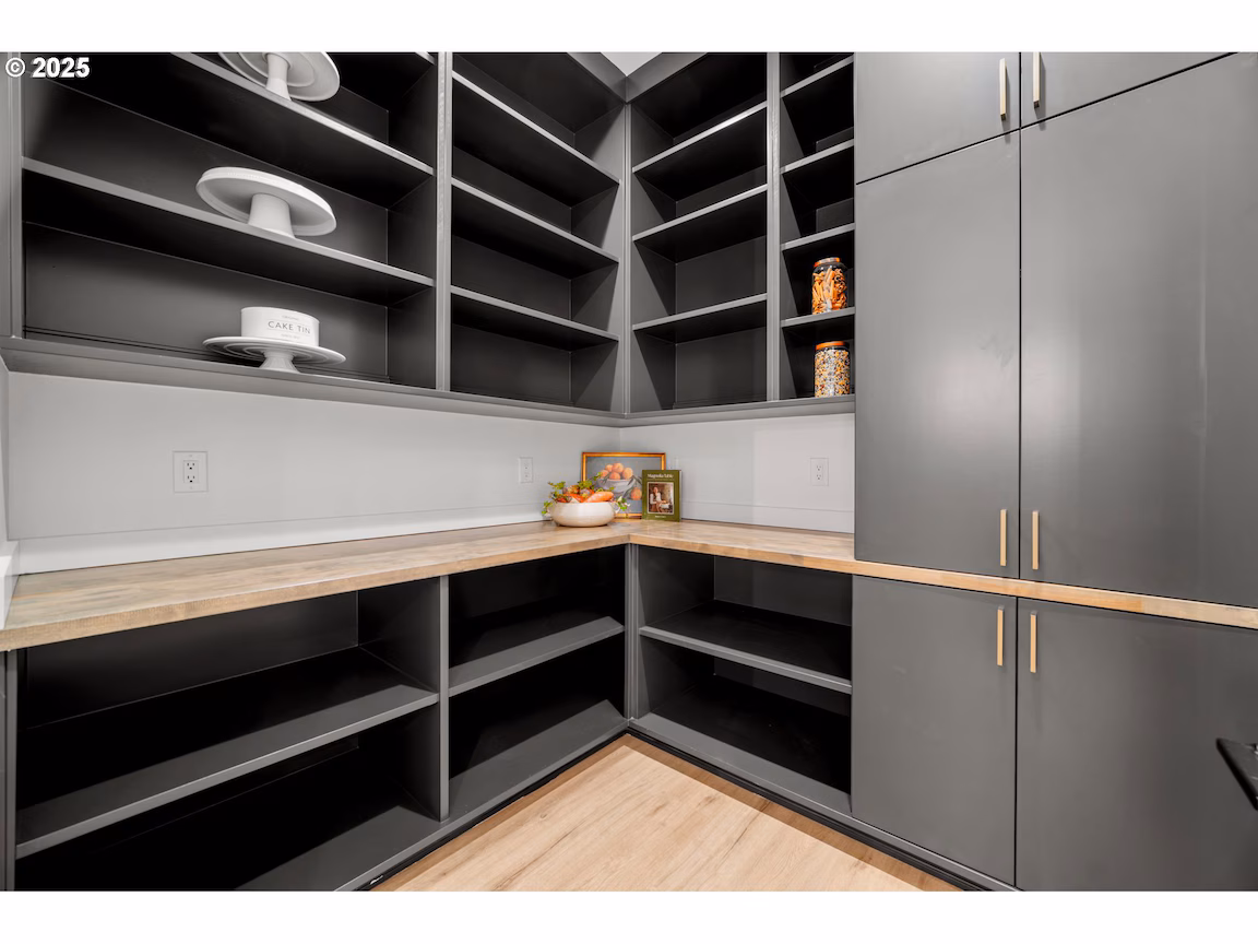 Modern kitchen with sleek cabinetry and open shelving.