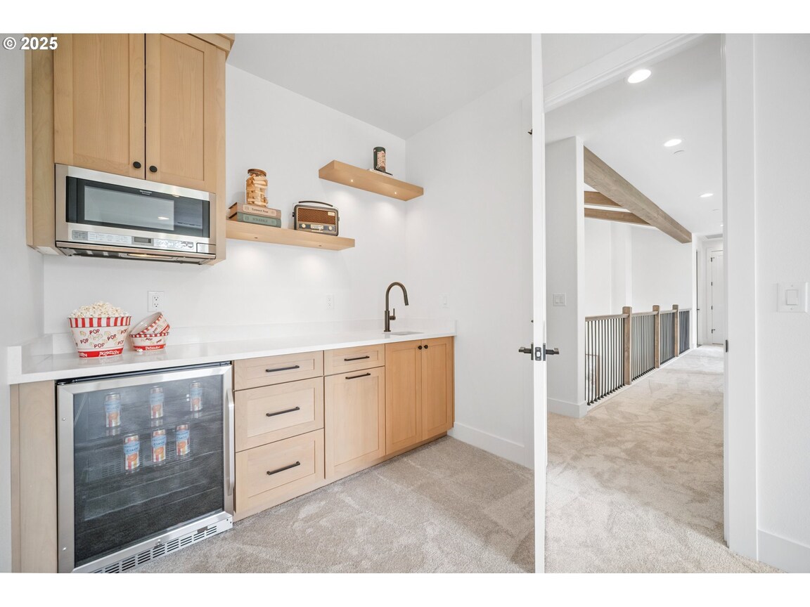Modern kitchen with wood cabinetry and sleek design.